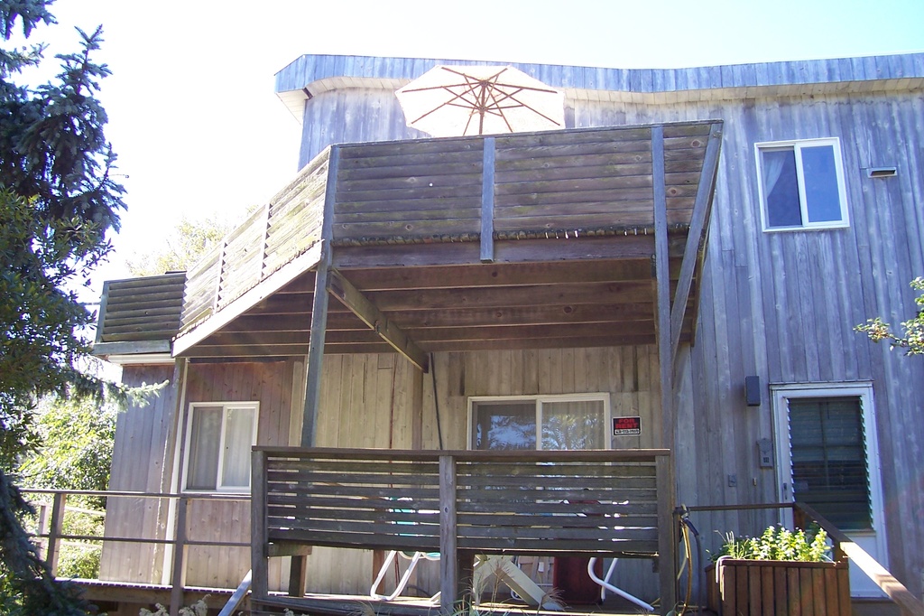 Large 2 story home on 80'x80' lot. Room for auto and cart parking with 1 car attached garage. Completely enclosed area under the house for storage, etc. Lots of room outside for gardens or storage. Rear of the building has a 7x25 ft attached shed with a workbench. There is also an enclosed outside shower. This was a builders residence, set up for occupancy upstairs into the winter. Was rented for $3500/week this past season. Downstairs features a large open area, 2 bedrooms, full bathroom, wash/storage room, and a large unfinished attic for storage and entry down to garage. Upstairs has another large open area with vaulted ceilings, galley kitchen, master bedroom with a king bed, walk in closet, and full bath. Decks are wrapped around 3 sides on both floors.
No Sandy damage whatsoever.  Perfect home for a contractor or someone desiring something larger than the 3br 900 sq ft ranch common to the area. Most furnishings are included.