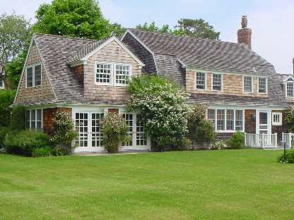 Dating back to the late 1800's, and once part of the expansive Sandacre Estate, this home has withstood the test of time. The Gambrel style shingled cottage is full of original details but at the same time is updated for today's lifestyle. The warm and large country kitchen complete with fireplace is outfitted in modern high end appliances. A formal dining room, big enough to handle a huge crowd, overlooks the expansive grounds. The living room is lined with French doors and large windows bringing the outside in. The jewel of the property is a large renovated barn with exceptional original trims, period barn doors and natural woods. Inside there is wonderful space for entertaining, a huge shower room, separate bath and a fun second floor loft area large enough to sleep several guests. The very secluded grounds are improved with a gunite pool, herb garden and child's play house. This home has been meticulously maintained and is one of Quogue's most valued treasures.