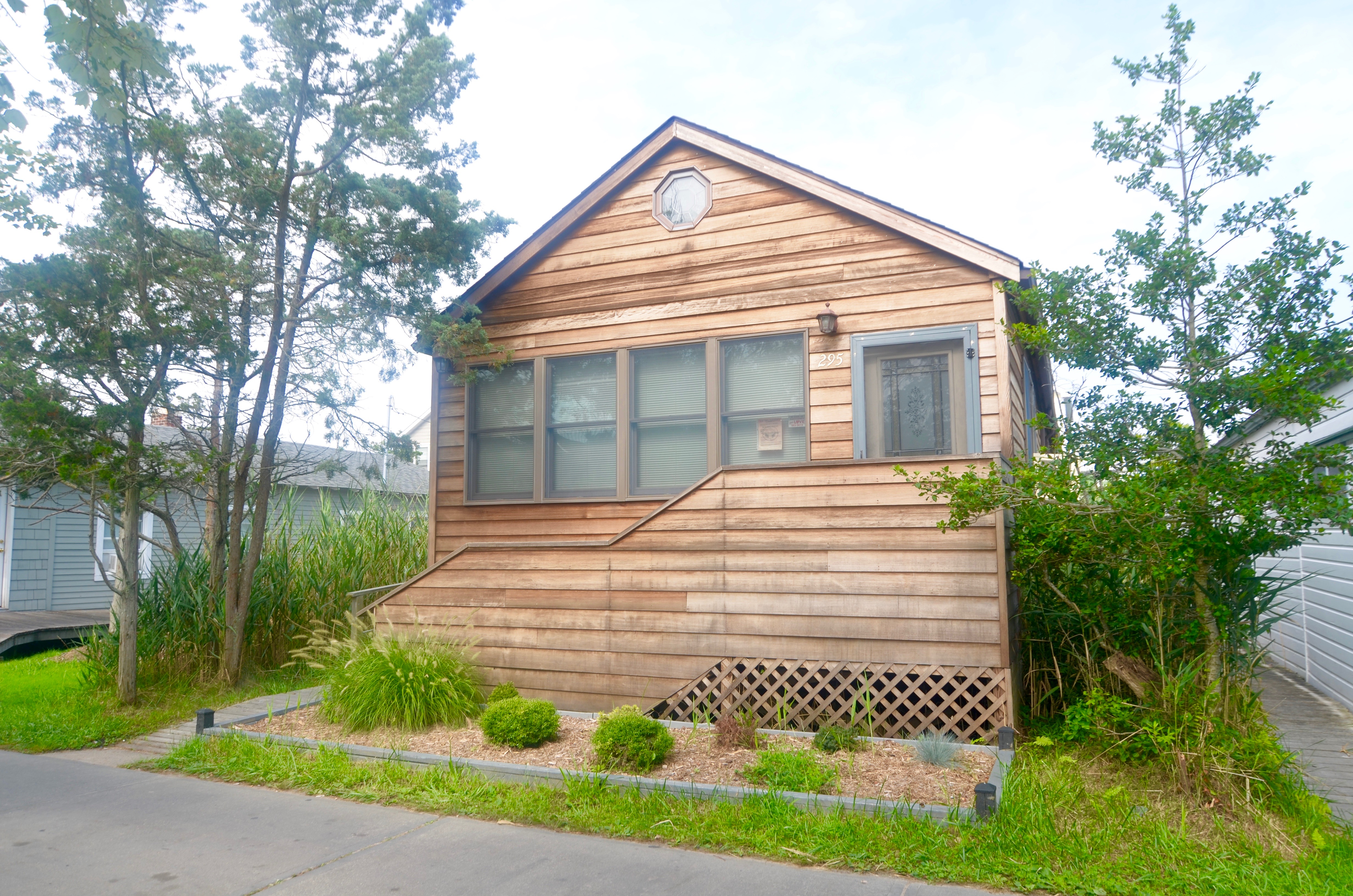 This welcoming cottage is suitable for year round use.  The comfortable living area is open to the kitchen and dining area.  Roof and foundation recently replaced.  Large master bedroom with attached half bath.  Sunny rear deck and outdoor shower.  Great starter home at an excellent price!
