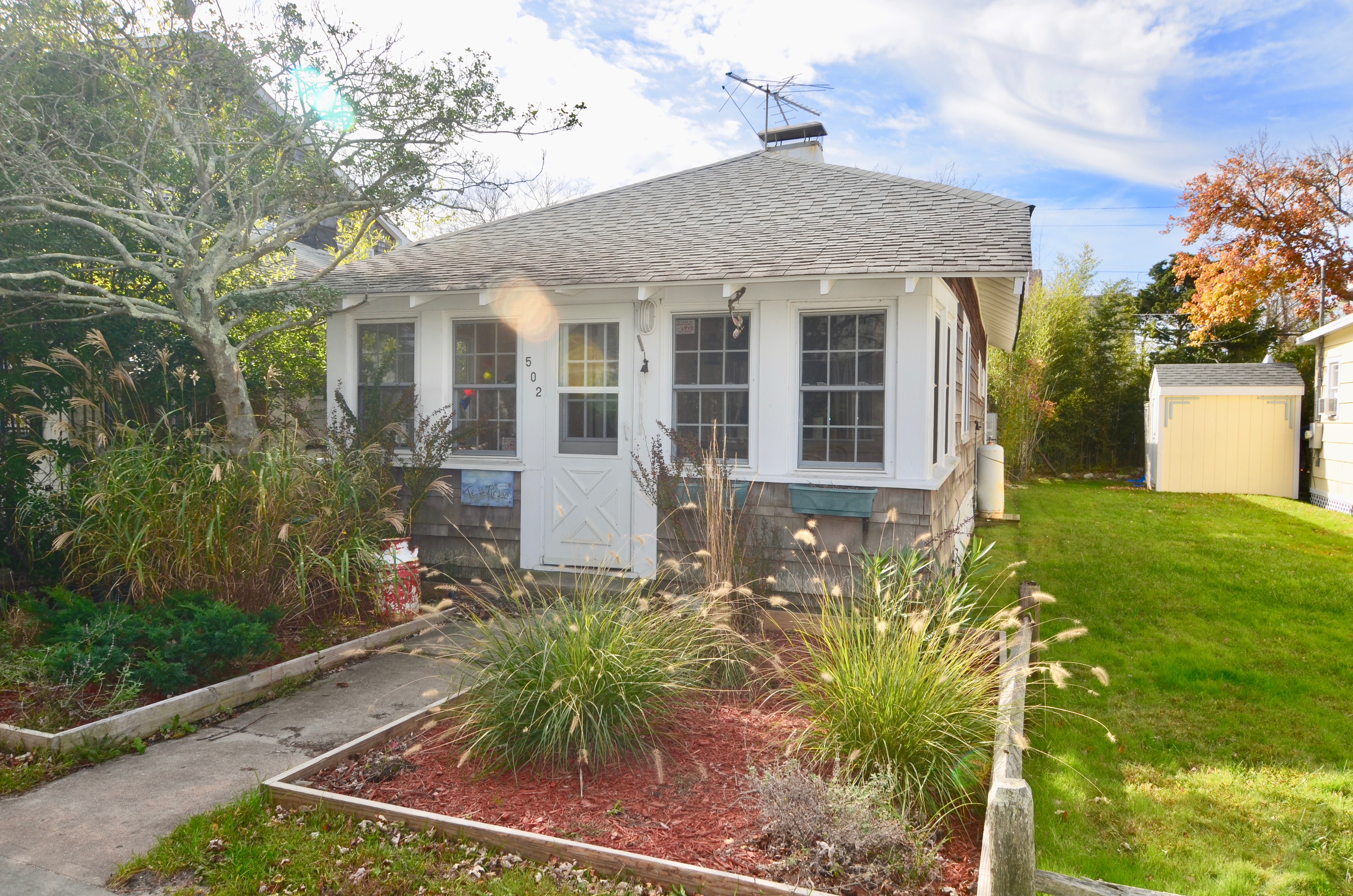 This 3 bedroom 2 bathroom bungalow is the ideal beach retreat. Conveniently located to town and close to the beach. Enclosed porch, great for dining. Cozy living area and charming kitchen with spacious countertops. Updated bathrooms and comfortable bedrooms. Great back deck for entertaining and outdoor shower. Homeowners Insurance: $1713. Flood Insurance: $803