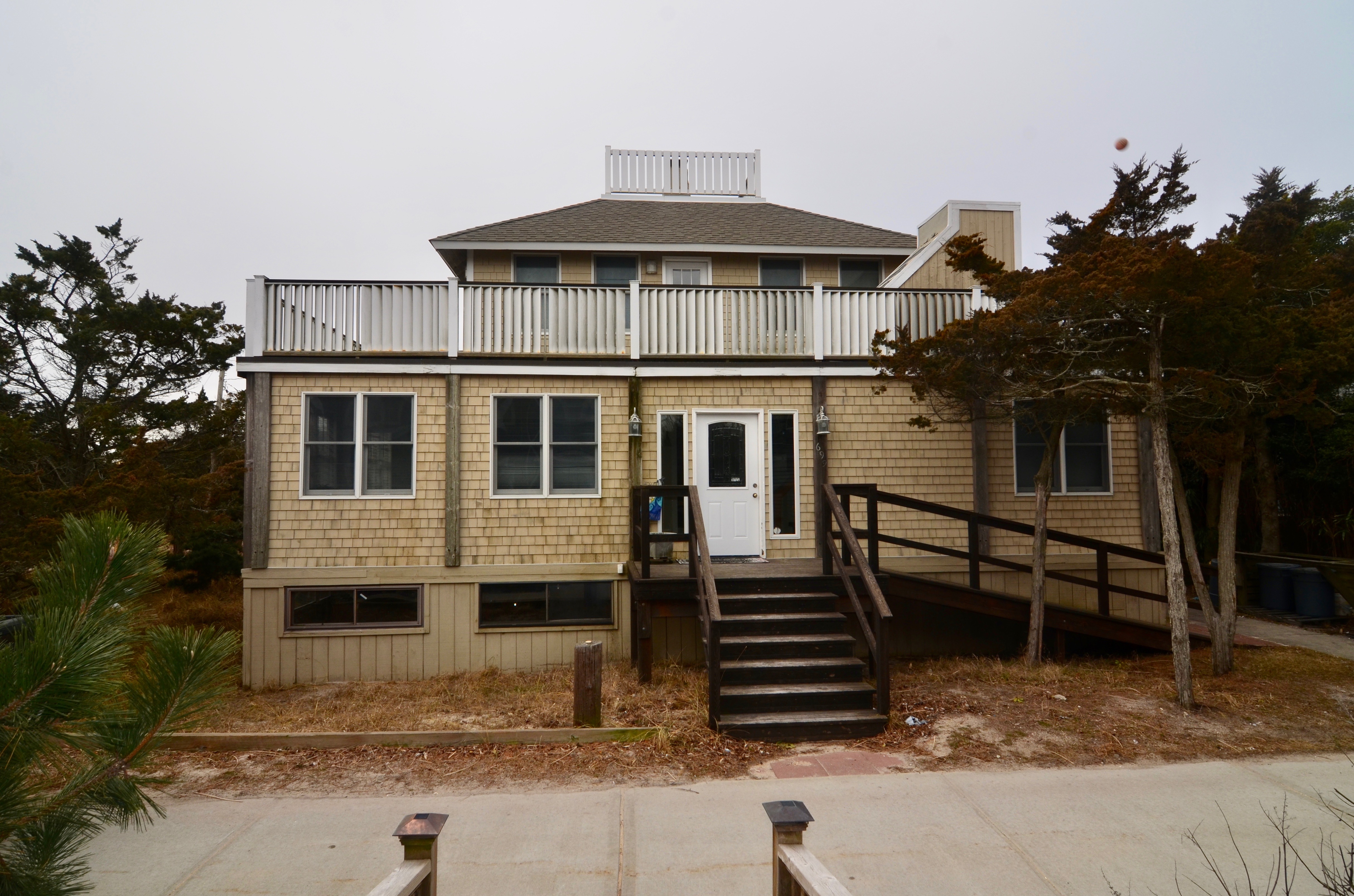 Large 6 bedroom oceanfront home in Ocean Beach with stunning ocean views and incredible potential! This home sits on a large 100' x 80' foot double lot and has the potential to add a pool. Enclosed porch open to the living area, working fireplace, updated kitchen, dining room and laundry on the first floor. two bedrooms and full bath downstairs, 4 bedrooms and 1 bath upstairs. 2 bedrooms upstairs have stunning ocean views and sliding doors onto wrap around deck. Potential for an incredible master ensuite with ocean views. Roof top deck with 360 views of bay and ocean. Great value for a blue chip asset. Enjoy the home as is, or bring your architect to capitalize on this opportunity to create a rarely available trophy oceanfront home with a pool overlooking the beach.