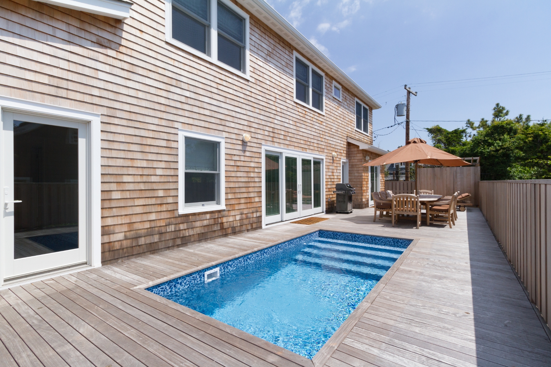 New construction close to the beach with a Pool! Only a 2 minute walk to the beach! This 4 bedroom 2.5 bath house has everything you need to enjoy life on Fire Island.  The first floor of the home consists of a screened porch which opens into a large great room with fire place.  Open seating throughout the living room, kitchen, and dining area provide enough room for the whole family to comfortably spend their time together. The living room features oversize french sliding doors that open onto the pool deck. The first floor is completed by a private master suite that includes its own deck access. On the second story, the home features 3 ample size bedrooms and a full bathroom. The 2nd story also features a convenient laundry room. All the bedrooms have lots of windows making them light and bright. This house is move-in ready. Call to schedule your showing!