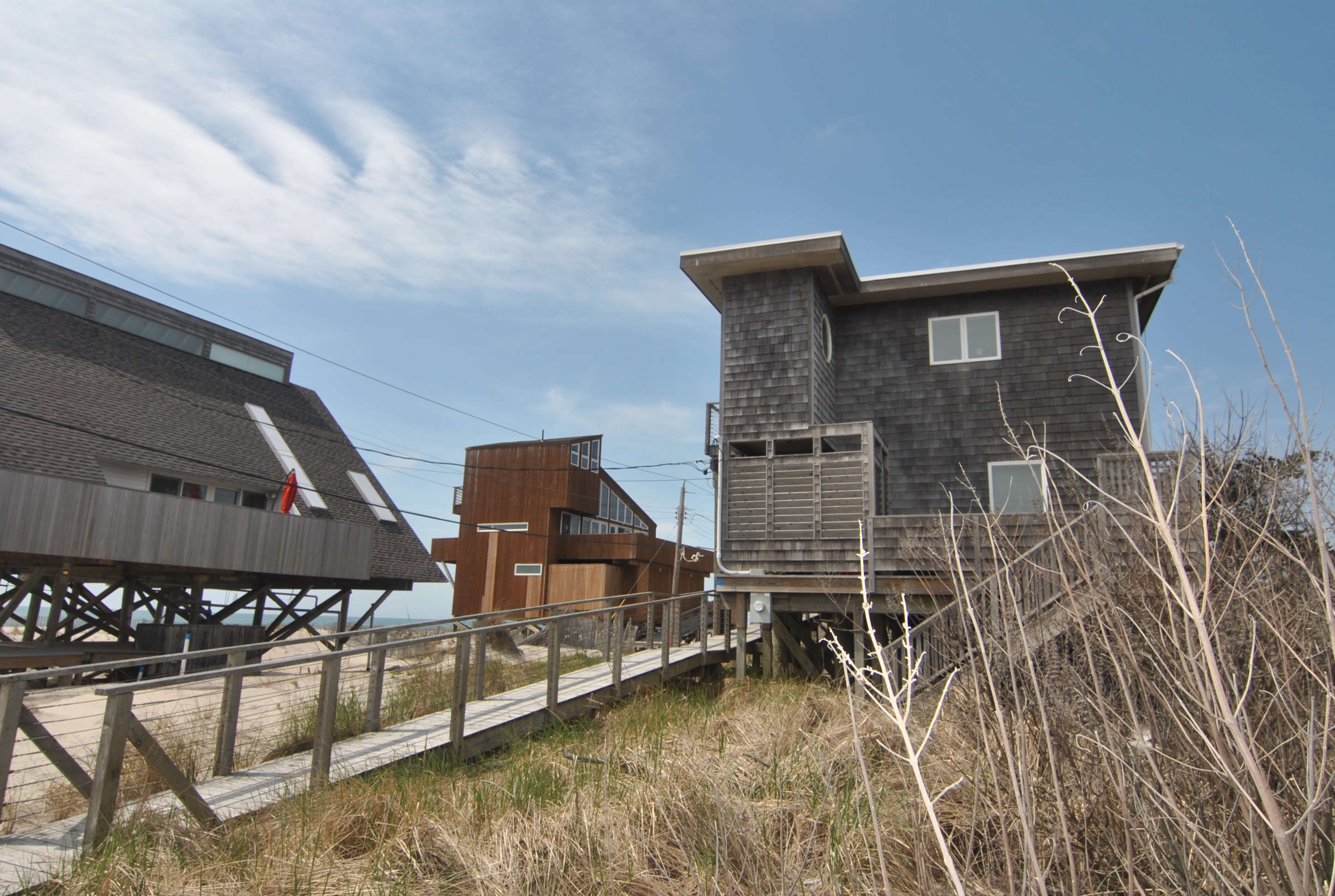 This stunning oceanfront has three charming bedrooms and 2 baths on the first floor, with ocean views in the master suite and front porch. Entire second floor is open living, dining, and kitchen area with spacious decks. Don't miss your chance to own a rarely available oceanfront property!