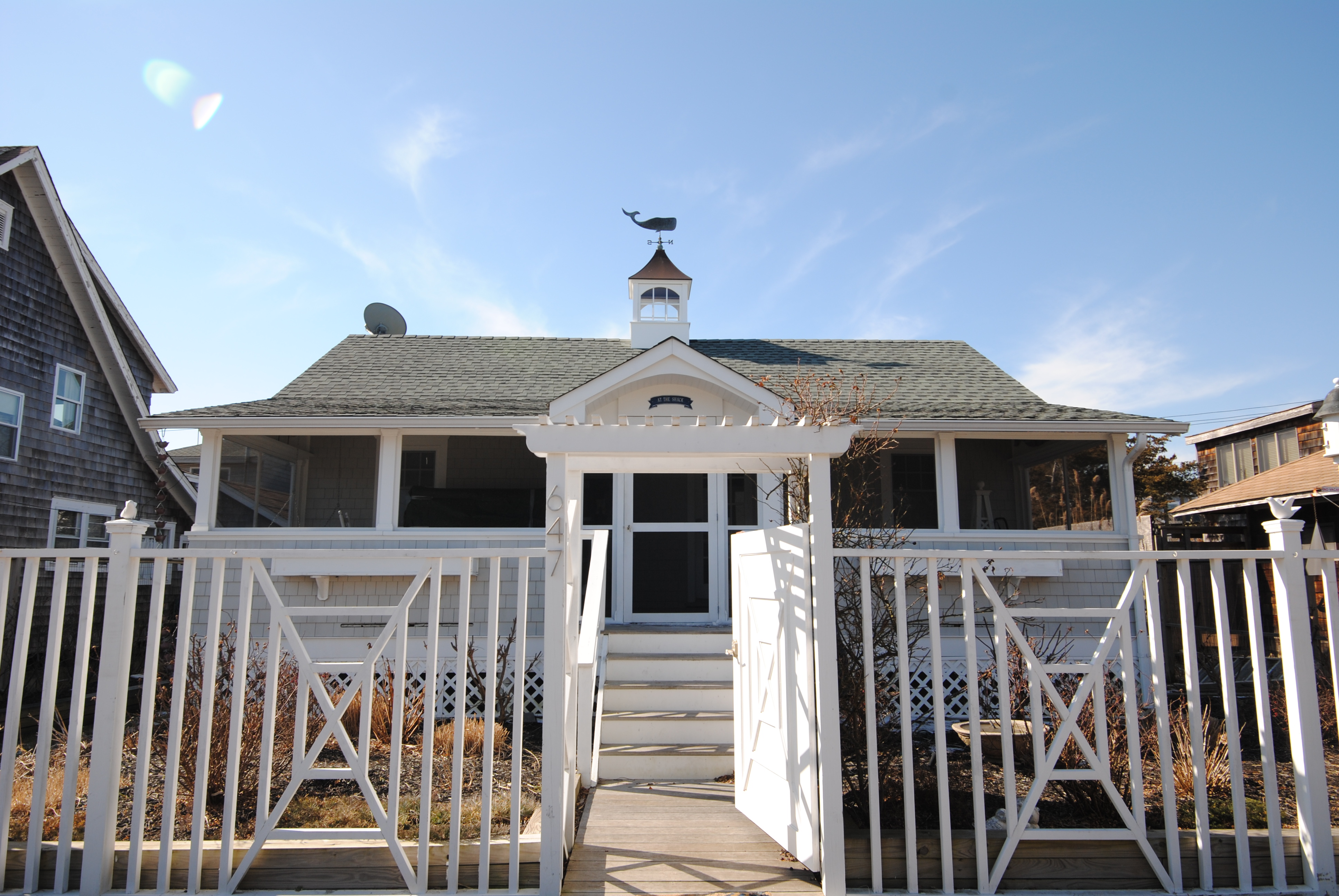 Spend your days at the beach, or your very own pool and afternoons and evenings relaxing on the welcoming screened-in porch in this cottage! Fully renovated interior including 3 bedrooms, sunlit den, beautiful white shaker kitchen with stainless steel appliances, and a lovely and spacious full bathroom. The large west facing rear deck features a heated swimming pool! Ideally located in the heart of Ocean Beach, just close enough to town for convenient access to the ferry, restaurants, and boutiques, and just far away enough to be peaceful and quiet!