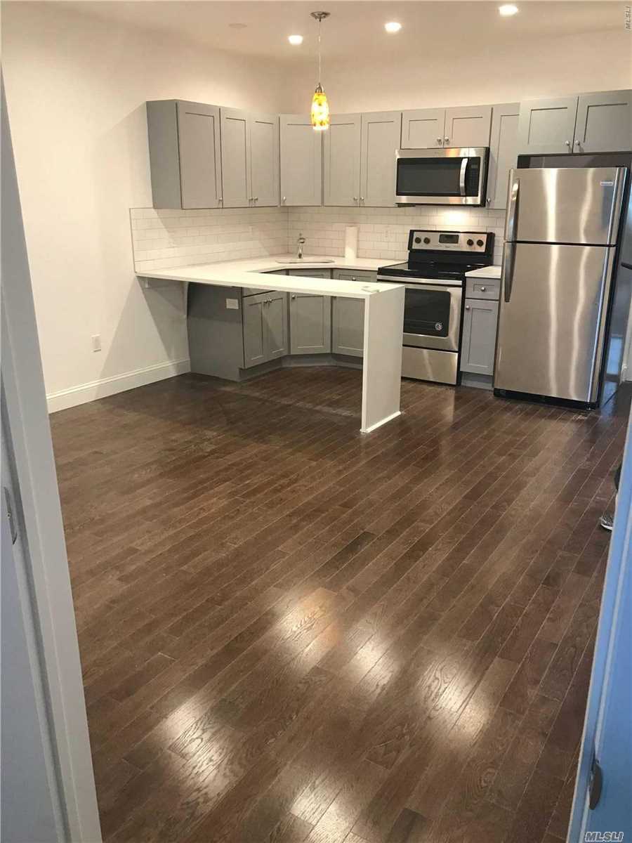 Brand New 2 Bedroom For Rent in Middle Village. Features Living Room, Dining Room, Kitchen with New Stainless Steel Appliances, and 1 Bathroom. Hardwood Flooring Throughout. Central Air. Heat and Water is Included. Close to Transportation and Shops!