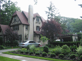 Serenely situated tudor home on beautifully manicured oversized property. Reminiscent of the English countryside.  Sauna in the basement