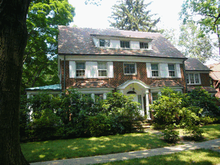 fully updated and upgraded colonial in a picturesque  shaded setting.   Set on a double lot this elegant home has been extensively upgraded and updated, while maintaining many of the graceful features of a bygone era.  One of the few homes in Forest Hills Gardens to feature a lap pool in the basement.  Some of the outstanding characteristics include a 10 zone sprinkler system, new Gas hot water heater, new furnace, New 2 zone central air conditioning, electricity upgraded to 500 AMPS! and line buried, all new outlets and switches.  Mahogany custom garage door.  Kitchen features Zodiac countertops, a JennAir professional 6 burner plus griddle and 2 ovens(1 convection), fully wired for internet, wireless alarm system w/ central smoke alarm.  Fully landscaped and equipped with Architectural liighting.