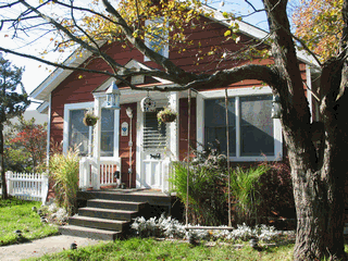 Enchanting summer house, centrally located to town and beach. Lovely decor three bedrooms with A/C and a very comfortable kitchen and dinning area. Back yard has good layout and a  really sweet playhouse. Available for July 2009. Inquire for June and July.