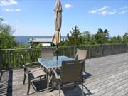 4 bedrooms ,3 baths, A/C, large deck with great Bay views! Finely appointed home with privacy.
Large living room, modern kitchen, formal dining room, Sleeps 10, multi-decks around home, and walkway to Bay and Ocean. Open 8/13 to 8/19