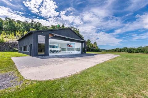 Former airplane hanger and classic car garage