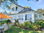 North Fork. Bay Front Charmer On The Beach at 15 Downs Boulevard in Jamesport. In coveted Fairhaven Private Community. Vintage cottage right on sandy bay beachfront. Summer 2025 only July offered $29, 500, September $12, 000, Fall/Winter months at only $6900 per (with 2 month minimum). Lovely and well kept getaway full of olde time appeal. Spacious open plan with water views, new central air, new waterside patio and outdoor furniture, sleek kitchen, stainless appliances, wood floors. The main floor offers 3 Bedrooms to include a water view primary en-suite (bath with walk in shower), and 2 additional guest bedrooms with a hall bath. Second level has 2 bedrooms (one is water view), a loft with dormitory style beds, and another hall guest bath. Swim, kayak, bring a small boat to moor. Sunbathe out your back door, or meander just one lane over to town facilities with expansive beach, tennis courts, playground and marina with 4 public boat ramps. The Sweetest Summer Vacation On The Open Bay!