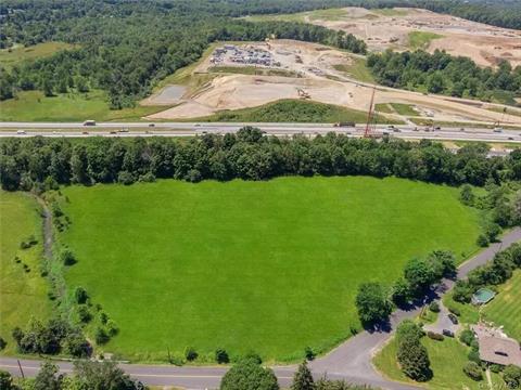 Looking approximately south, Otterkill is on left, Duck Farm Road on right, and Old Chester Road in foreground and Heritage Trail at the rear of the property. The raised trail bed and tree cover provide wonderful sound protection from the highway. Route 17M is obscured by the trees. Route 17/Quickwa