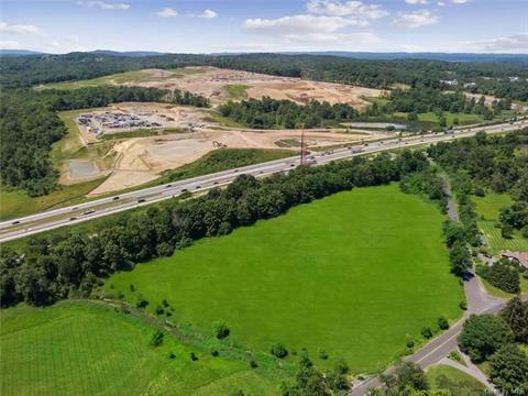 Looking approximately southwest, toward New Jersey and Pennsylvania. The red rig near the highway is a pile driver preparing the new entrance/exit from the highway.