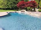 STUNNER 4BR DESIGNER HOME - PET FRIENDLY, HEATED POOL & BEACH!August 2 Weeks Only $15, 000 and $18, 000! First Time Offered! (see below) Fabulous vacations on the coveted Esplanade in Angel Shores, with a deeded sandy bay beach and heated freeform lagoon pool with a waterfall. Property is fully fenced and private, with many lounge areas for sunning, a shady pergola when needed, and a great outdoor shower. We offer a pet friendly policy, rare for an exceptional residence, to bring your darling family member pup with you on vaca. Sensational whole house designer renovation. Stunning new upscale showhouse kitchen steals the show with exquisite old world stone craftsmanship, professional stainless appliances, and sleek large scale quartz workspace everywhere. Supplemental butler service area was added for entertaining in style, all new chic furniture, this is a dream home to enjoy and spoil all your summer guests. The sizable primary king en-suite is located at the end of hall for privacy. It has also been newly renovated with a spa like bathroom to pamper yourself: a slipper soaking tub, double sinks, and huge shower with seating, a rain head and a hand held system. All 3 guest bedrooms are nicely appointed, there is another full spa like bath with shower and seat for guests, as well as a main level powder room. Brand new 2nd level laundry convenient to bedrooms, and a desk with wifi access in loft area. The lower level finished family room has television, pool table, electronic pacman game, and a huge sunny egress window. The bay is so close, you can hear the waves and feel the breeze off the water relaxing on the front porch. The rear sunroom is spacious with views of the pool, there is a firepit, a standby auto generator, lots of pool toys, kayaks, paddle board, bicycles! A new wow outdoor patio addition this season is a Mont Alpi stainless outdoor kitchen: BBQ cooking, serving station with countertop, and a wine refrigerator! Your best ever summer vacation poolside and by the sea shore starts here! June $24, 500; July $29, 500 (rented); **Nicely Priced Prime August 2 Week Rentals! Aug 1st thru 18th Only $15, 000, and Aug 19th thru LD Tuesday Sept 2nd Only $18, 000!, enjoy Labor Day Weekend! Full month August also available from the 1st thru LD Tuesday Sept 2nd $39, 500. RP# 439