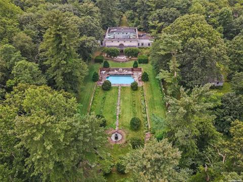 View of Studio, sunken garden, and garage cottage