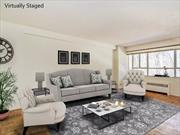 Wall of windows in living room and dining area in this 2 Bed / 2 bath beauty. Spacious apartment with galley kitchen, Light and bright bedrooms. Building boasts private park, seasonal pool parking.