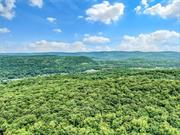 Absolutely breath-taking 25 acre parcel of land, in the very private, prestigious Village of Tuxedo Park. This a beautiful swath of land, features hills, rock escarpment, walking paths, and several picturesque spots for siting your dream home. Different vantage points offer views of the surrounding parkland, and you will be captivated by the overwhelming sensation of being surrounded by the pristine natural habitat. This is a rare opportunity to build your own peaceful retreat within an hour of midtown Manhattan. Tuxedo Park is the location, situated within an easy commute to Manhattan and poised at the gateway to the Hudson Valley with its many recreational, art, antique, and dining attractions. Pictures cannot do justice to what you will experience by walking through the property, so schedule a visit to see for yourself.  All within 40 miles of New York City  Equal Housing Opportunity