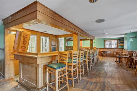 Beautiful wood bar with seating.