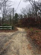 Wooded single and separate 1 acre residential building lot. Water and electric nearby. Beautiful new homes and subdivision in area. Several acres of town property behind this lot and great for horse riding or hiking. Verify Info with the Town of Brookhaven.