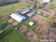 Barn for Lease, 12 Acres, 60 stalls, Indoor arena, Hot walker, 2 outdoor arenas, Round pen, Trail arena, Office, 2 living trailers for grooms, All equipment, phone, and internet included. Term of lease negotiable.