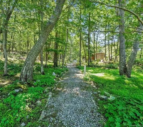 pathway to guest house - it also has a driveway shared with the main home