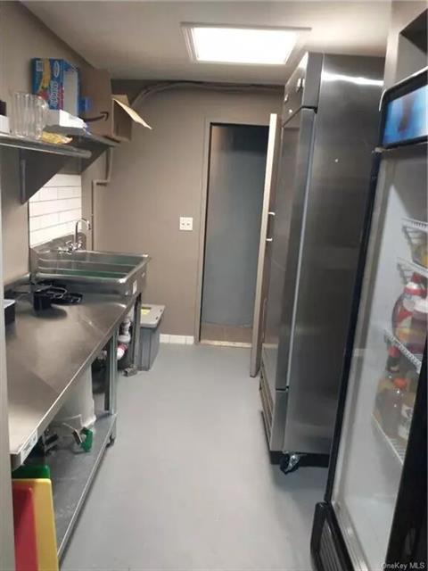 NEW PREP KITCHEN AREA WITH NEW FREEZERS AND REFIGERATOR