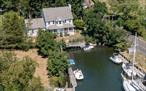 Waterfront home with floating dock and bulkhead with water views and bay breezes on protected Stirling Harbor with access to Peconic Bay. Featuring covered waterside front porch, great room with gas fireplace, formal dining room, spacious eat-in kitchen, half bath, and laundry on first floor. Master suite with sitting room/office and full bath, and 2 additional bedrooms and full bath on second floor. Attached 2-car garage.