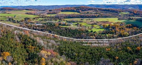 Looking over the eastern woods into Connecticut. Direct access to the Harlem Valley Rail trail.