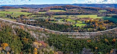 Looking over the eastern woods into Connecticut. Direct access to the Harlem Valley Rail trail.