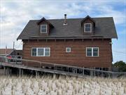 Oceanfront 5 bedroom, 2 bath Unique Cape Cod with Views from Every Window. Open Layout Living Room, Dining Room & Kitchen with Cathedral Ceilings. Enjoy the Sprawling Deck with Outdoor Shower & Incredible Ocean Views. Perfect for Entertaining.