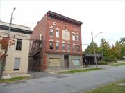 This grand old brick building was once the home for the Monticello Masons and has always been refered to as the Masconic Building . Built, probably in the early 1900&rsquo;s it has a unique architecture in the front. There are three floors each having about 4, 560 sq. ft. for a total if 13, 680 sq. ft. with a full basement. Renovations have been started. There is a new concrete floor in the basement and all the stone walls have been reapointed to make them water tight. New sewer pipes have been installed in the basement and a hot water heater. Upstairs there is all new subflooring throuhout the building. Some walls were taken out others were reinforced. All the old ceilings were taken out and many rooms have new sheet rock . The top floor and the orginal home of the Masons has a large meeting room, still in very good condition. Building has many possibilities retail or offices downstairs and multiple apartments on the second and three floors is permitted. Located omly a few hundred feet from Broadway in the Village of Monticello you are walking distance to transportation, shopping, restaurants and more. Municipal parking very close by.
