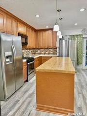 Fully Renovated Kitchen With New Stainless Steel Appliances, Huge Island. Living Room Wood Floors, Recess Lighting Half Bath. Second Floor Has Three Full Bedroom with Closets and Full Bath Full Finished Basement With Separate Entrance. New Boiler and Hot Water Tank. New Roof