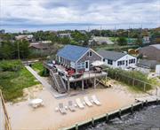 Bay Front Living & Spectacular Sunsets from the Deck of this Bayfront Beach House. This Home has Just been Entirely Remodeled with 4 Bedrooms, 2 Full Baths. New Pictures Coming Soon! Sleeps 12 Comfortably.