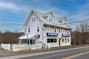 Ever dreamt of running a tavern or having your own sports bar? This is your chance with this turn-key investment opportunity that has everything included in the sale lock, stock and barrel: the real estate, the business, and all equipment and furniture. The Riverview neighborhood tavern has been rooted in the community for over 35 years. Overlooking a bend in the scenic Ten Mile River. Enter past the outdoor seating with river views into the main tavern room. There are 8 seats at the bar, with windows behind the bar bringing the river view indoors. Behind the bar is plenty of space for multiple barkeeps. High tables seat 16 in this room. The connecting room with restrooms and billiards seats 14, more without the pool table. The kitchen connects to behind the bar and the billiard room. Priced right to allow for updating and to make this your own. Outdoor seating overlooking the river and a sizeable parking lot. Additional income with 3 rentals upstairs, two 1-bedroom apartments and one 2-bedroom apartment, currently rented month to month. Oil heat for the tavern, separate electric meters for each apartment with electric heat. The location can&rsquo;t be beat, minutes to Route 22 and the neighboring towns of Pawling, Amenia, Millbrook and Millerton as well as the CT border with Kent, New Milford, and Sherman. Opportunities like this come few and far between.