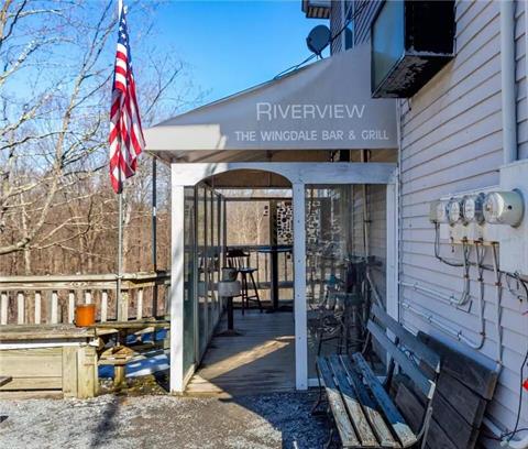 Seating on the porch overlooking the river.