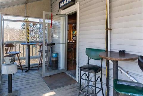 Seating on the porch overlooking the river.