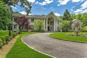 MILL NECK. Incredible Stone and Stucco Gated Colonial, Custom Built and Located on Over 5 Private, Beautiful and Wooded Acres, In the Heart of the Village of Mill Neck. Elegance and Class Radiate Throughout The Home, Featuring Grand Sized Rooms, Exquisite Detailing Within Every Inch of the Home; High Ceilings, Balconies, Tons of Natural Light Through Walls of Windows, Custom Marble Mantles on Fireplaces, Radiant Heated Floors, Full Basement with Theatre and Outside Access, Olympic Sized Inground Pool, Pool House, Patios, Formal Gardens and Much More!