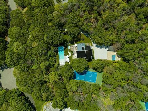 Perched high above on a shy 2 acre parcel