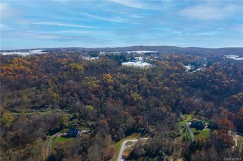 Rare opportunity to own this magnificent parcel in the heart of Brady Brook Falls and Quaker Hill. View from the base of the property, which begins at the end of the cul-de-sac.