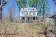 VICTORIAN WITH HISTORY IN THE CATSKILLS! This beautiful home sits nicely back from the road, across the rail trail. Original hardwood floors, pocket doors, vaulted ceilings, large windows, original moldings and trims. Live-in the two bedroom ranch while complete renovations or rent out for extra income. This property is zoned both commercial and residential which could be used as a Bed and Breakfast, Airbnb, antique shop or simply for an individual who works from home. Further, a mediation retreat, spa, gallery, or yoga studio the potential is endless!