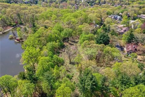 Halsey Pond is in the back of the property, so you have the potential of lovely water views with enough space and buffer area for privacy and peace.