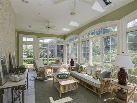 Primary bedroom w/fireplace and direct water views