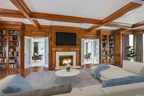 Primary bedroom w/fireplace and direct water views