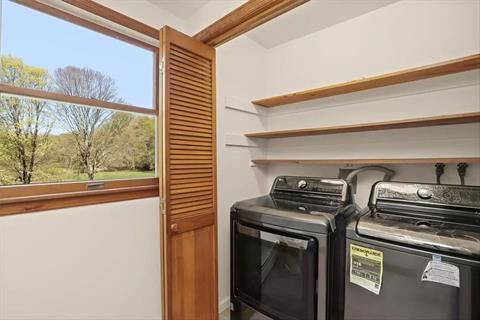 Primary Bedroom with a large skylight