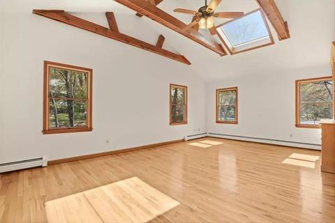 Sun-drenched Family Room open to Kitchen/Breakfast area.