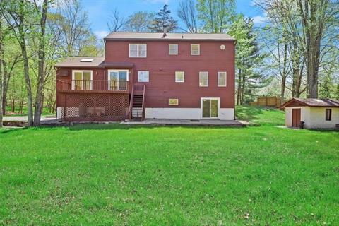 4 Bedroom Center Hall Colonial style home with sun-drenched formal rooms.