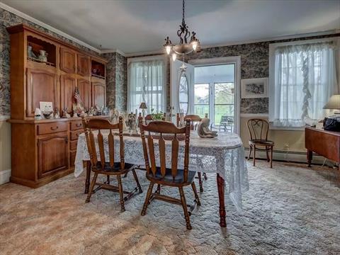 Everyone will love hanging out in this large great room. Walls of windows just let all of the sunlight in.