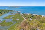 This iconic North Fork waterfront property on West Creek is the perfect place to relax and unwind. A masterfully crafted Victorian on picturesque New Suffolk Avenue with 8.9 acres on West Creek, access to Peconic Bay and deeded beach rights to a sugar sand beach just steps away. The house features 7 large ensuite bedrooms, a 32-foot indoor pool with a water park slide and hot tub, a generous well-appointed kitchen, and multiple fireplaces. Numerous rooms for relaxing and entertaining guests as well as a perfect work from home suite. An amazing outdoor fireplace complements the exterior with incredible views to enjoy every season on the North Fork. A short stroll to North Fork Country Club, fishing, clamming, kayaking... you can do it all! Perfect as a compound or a Bed and Breakfast venture. Nature at its best combined with endless amenities and several marinas nearby, make this a sanctuary that you will never want to leave! If you are looking for a truly unique home, look no further!