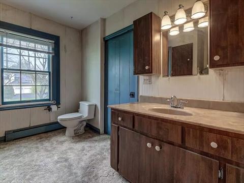 Upstairs bathroom with newer shower.