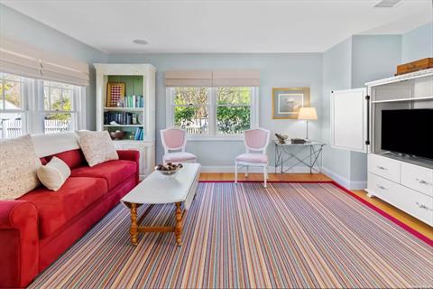 LIVING ROOM WITH WIDE-SCREEN TV